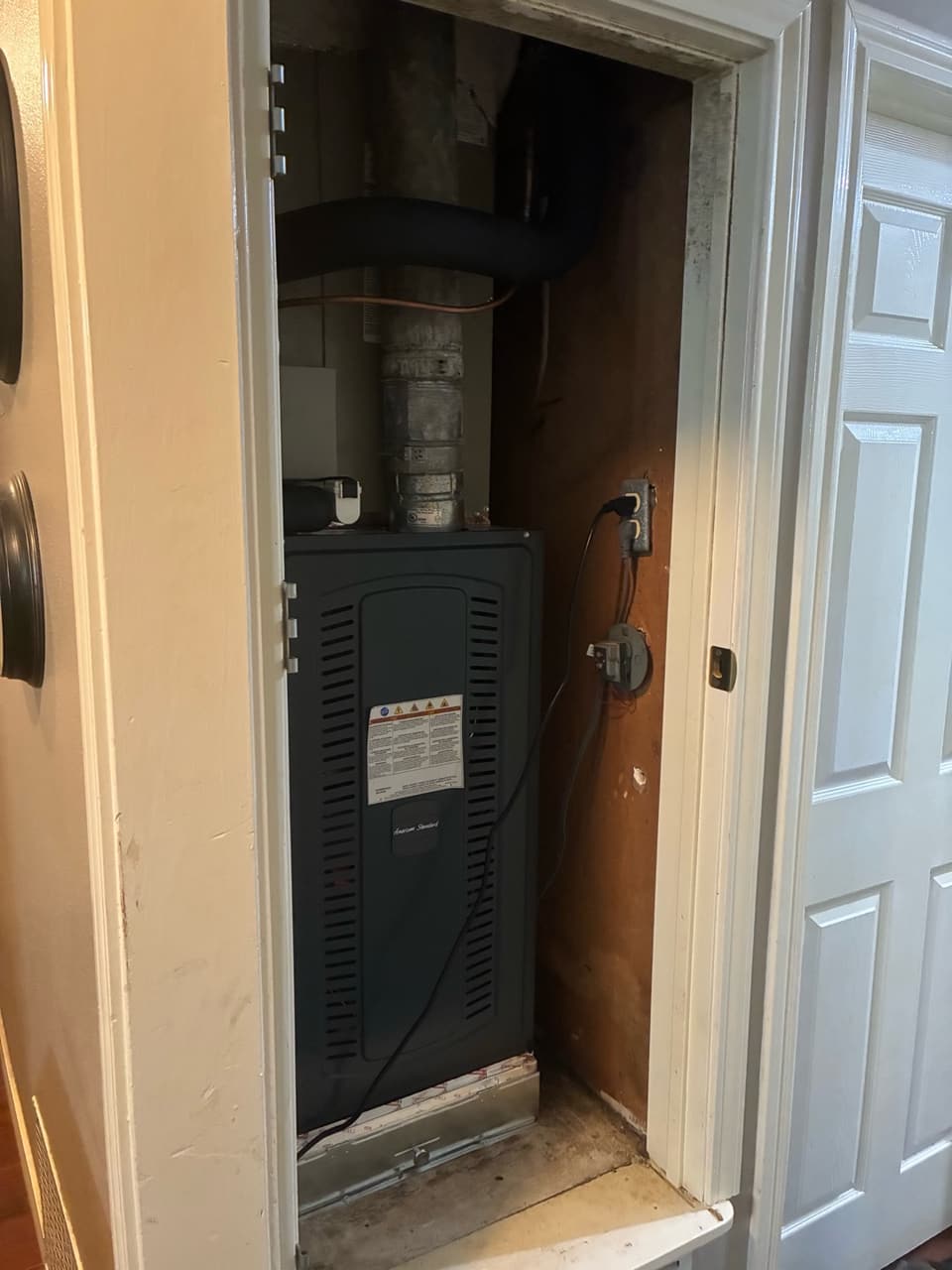 American Standard furnace in a closet, installed by Total Assurance